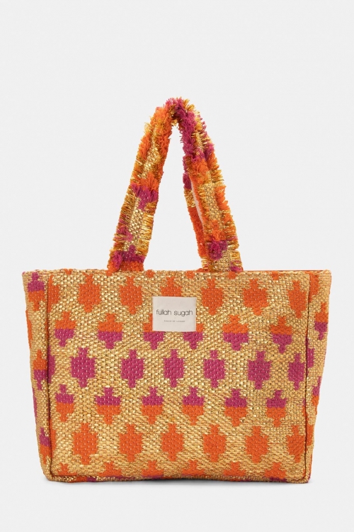 Woven bag with fringes and a bold pattern