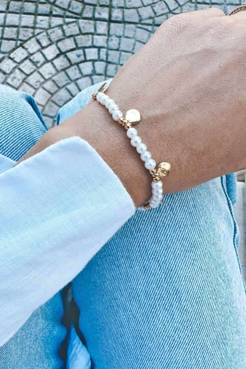 Bracelet with white beads & tassels
